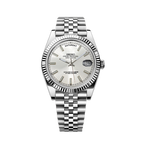 Silver Seiko watch with a white face on a white background
