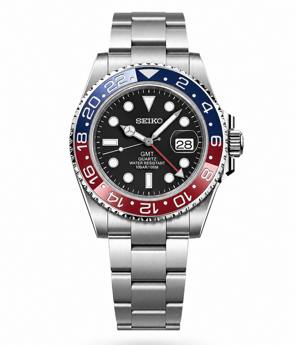 A Seiko GMT watch with a stainless steel bracelet, black dial, and a two-tone blue and red bezel.