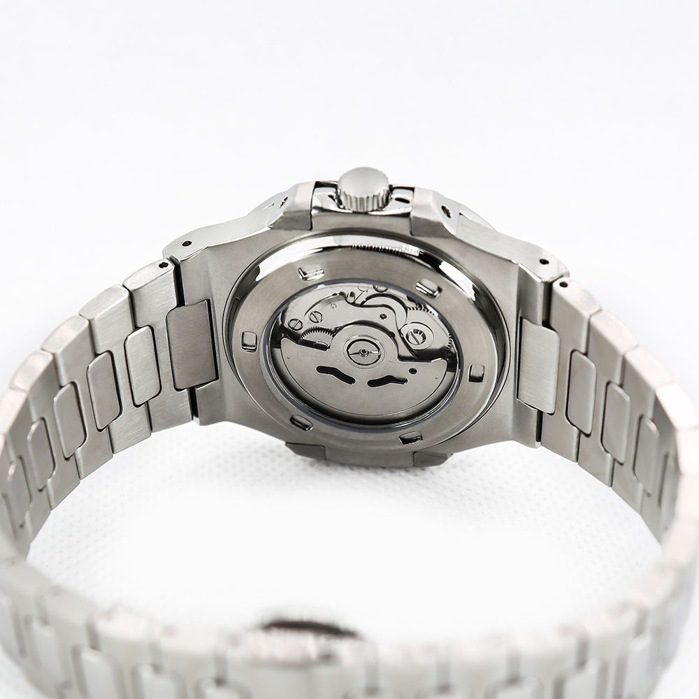 Silver watch with mechanical movement on a white background