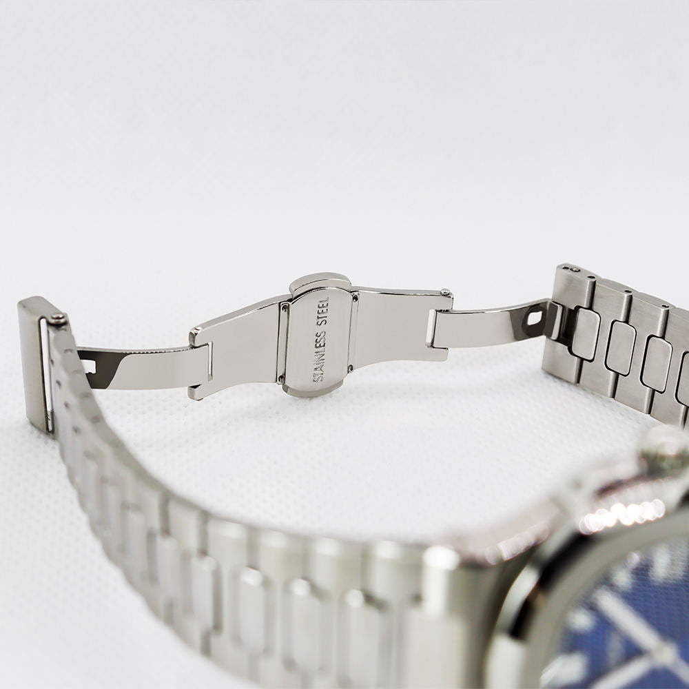 Close-up of a silver watch band on a white background