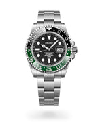 Seiko watch with black face and green bezel on a white background