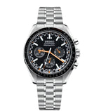 Seiko watch with black dial and silver metal strap on a white background