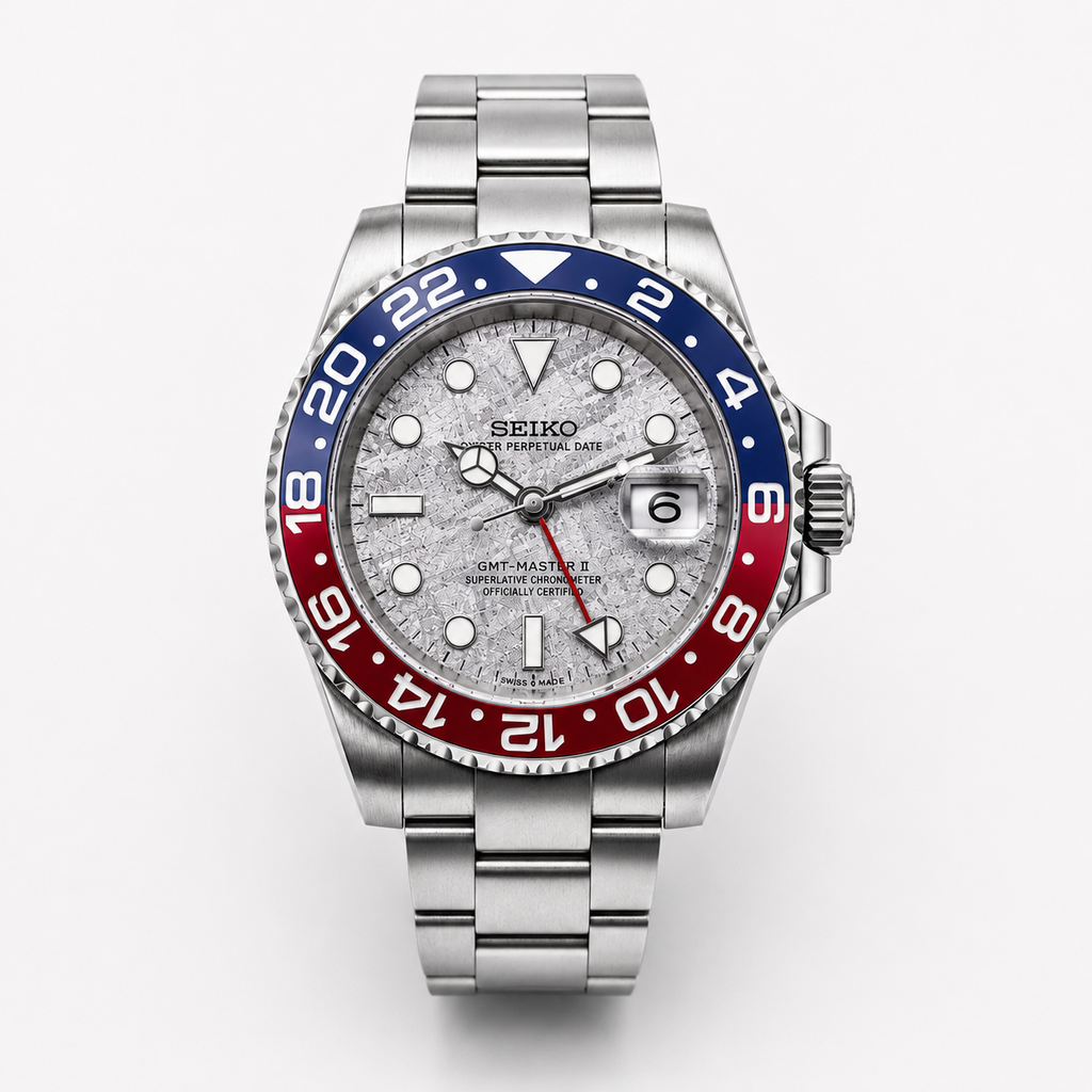 Seiko watch with a silver case and red and blue bezel on a white background