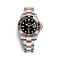 Seiko watch with black dial and rose gold accents on a white background